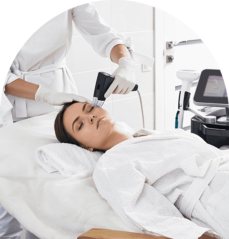 Woman receiving facial treatment in spa.