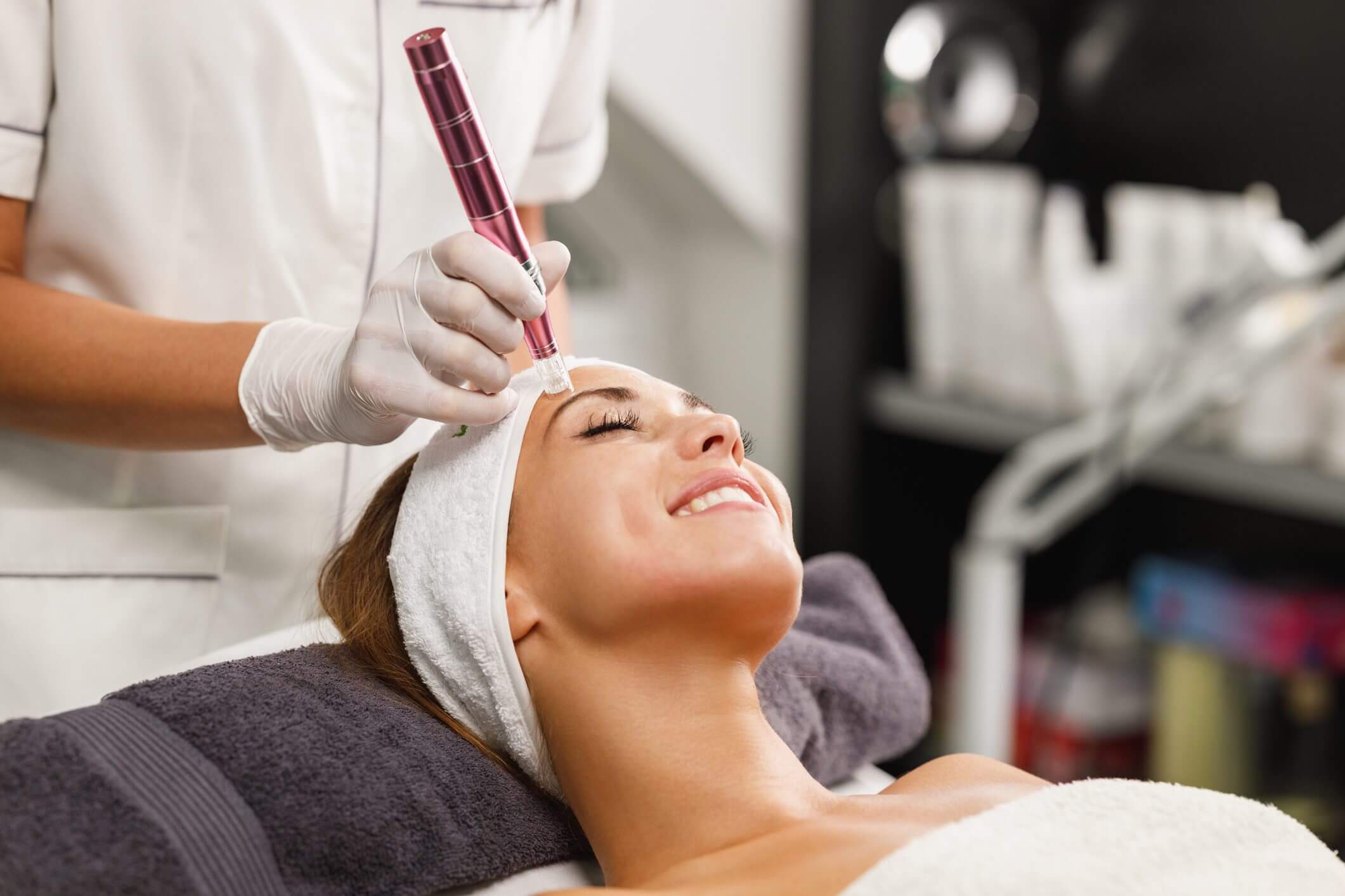Woman enjoying a facial treatment at a spa.