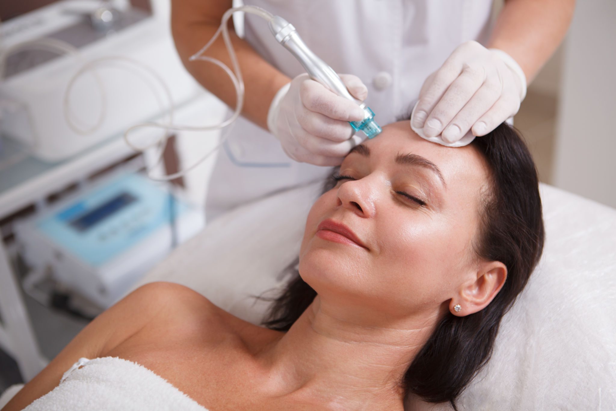 Woman receiving a facial skin treatment.