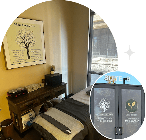 Spa treatment room with framed tree artwork.